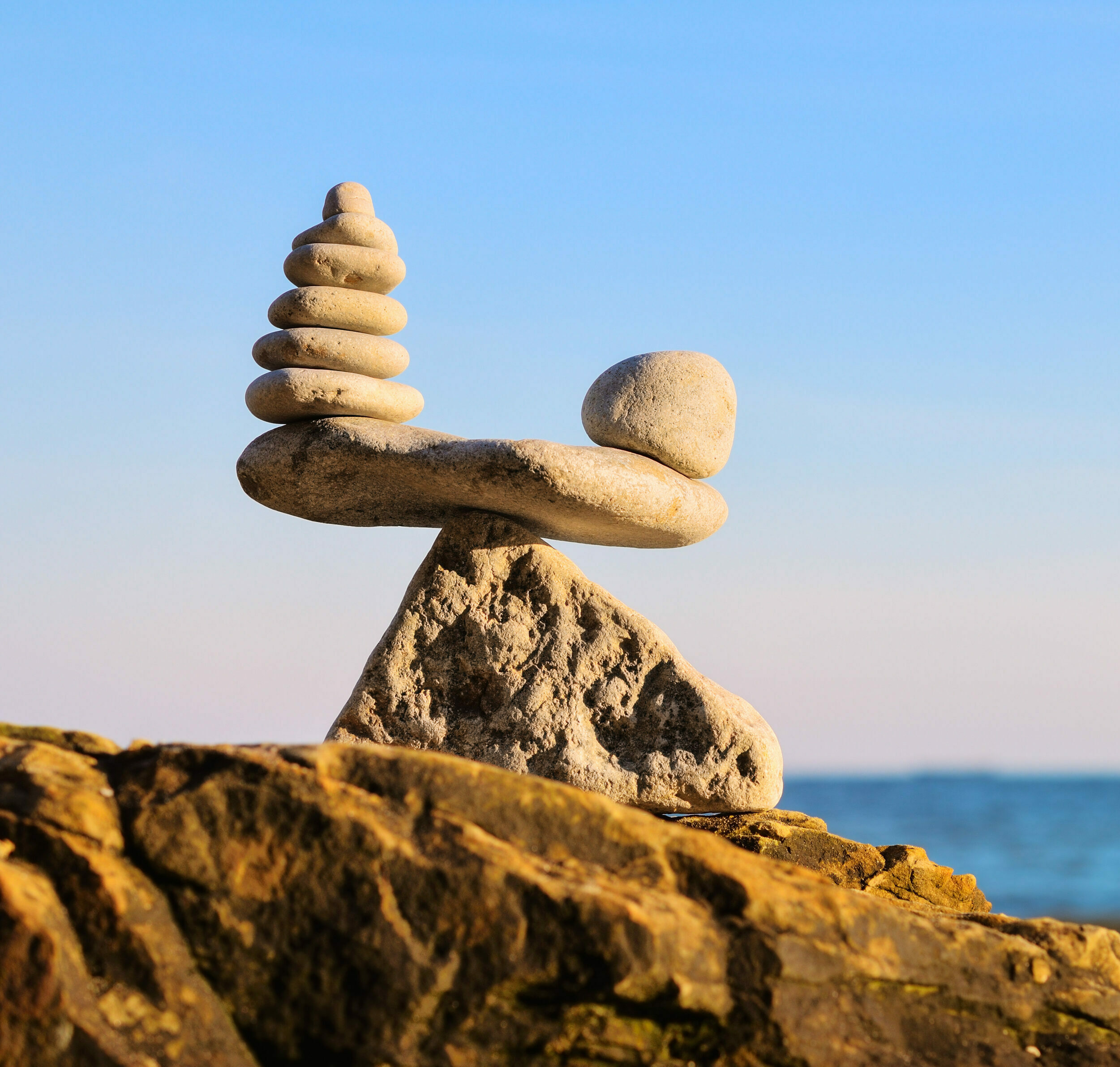 Stack of zen stones in balance at seashore